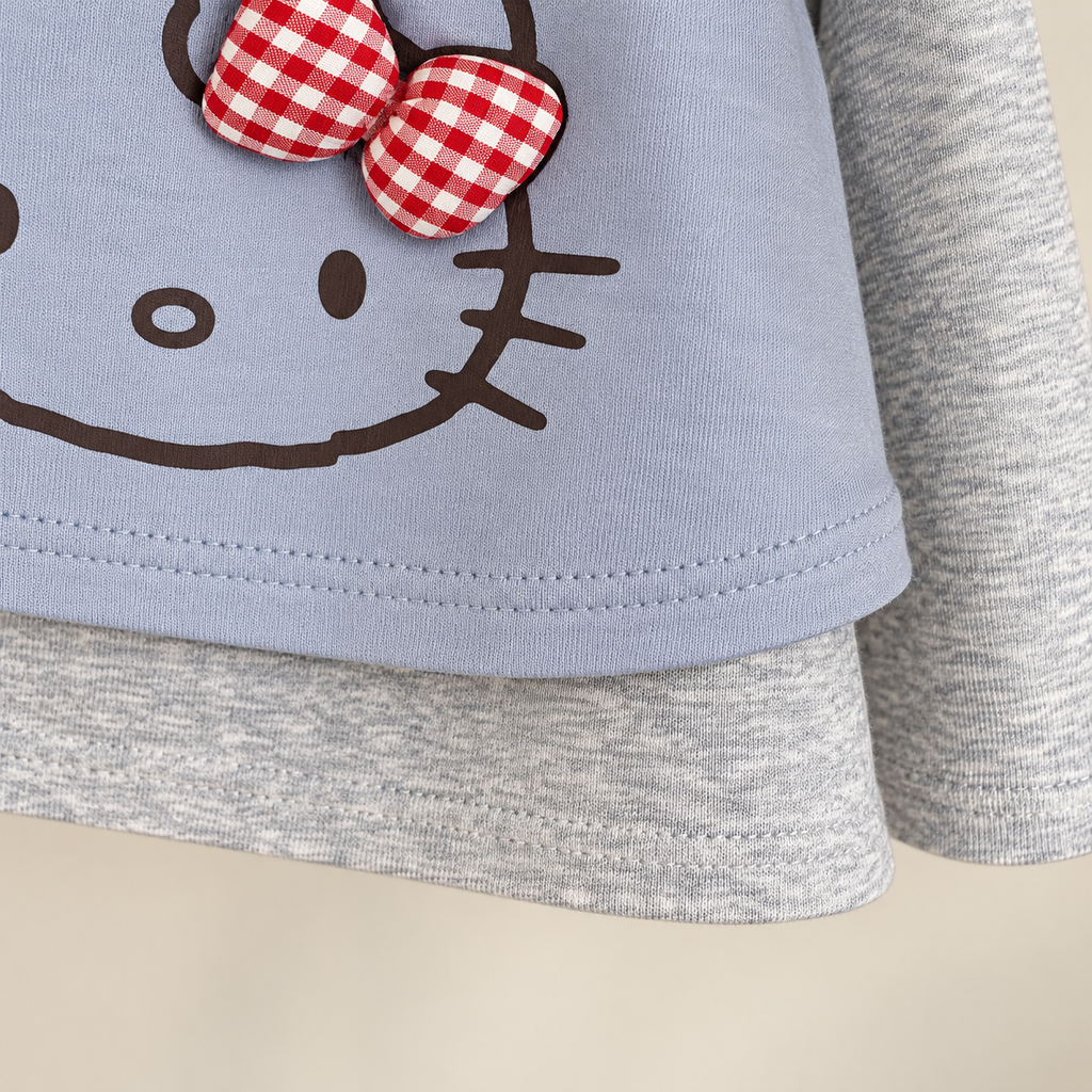 Blue cat bow top hem detail.