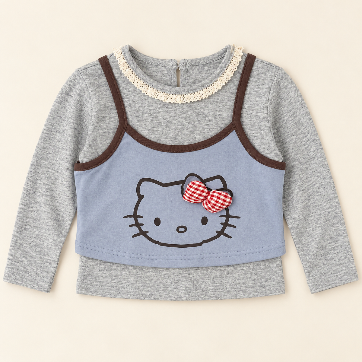 Blue cat bow layered-look long sleeve top, front view.