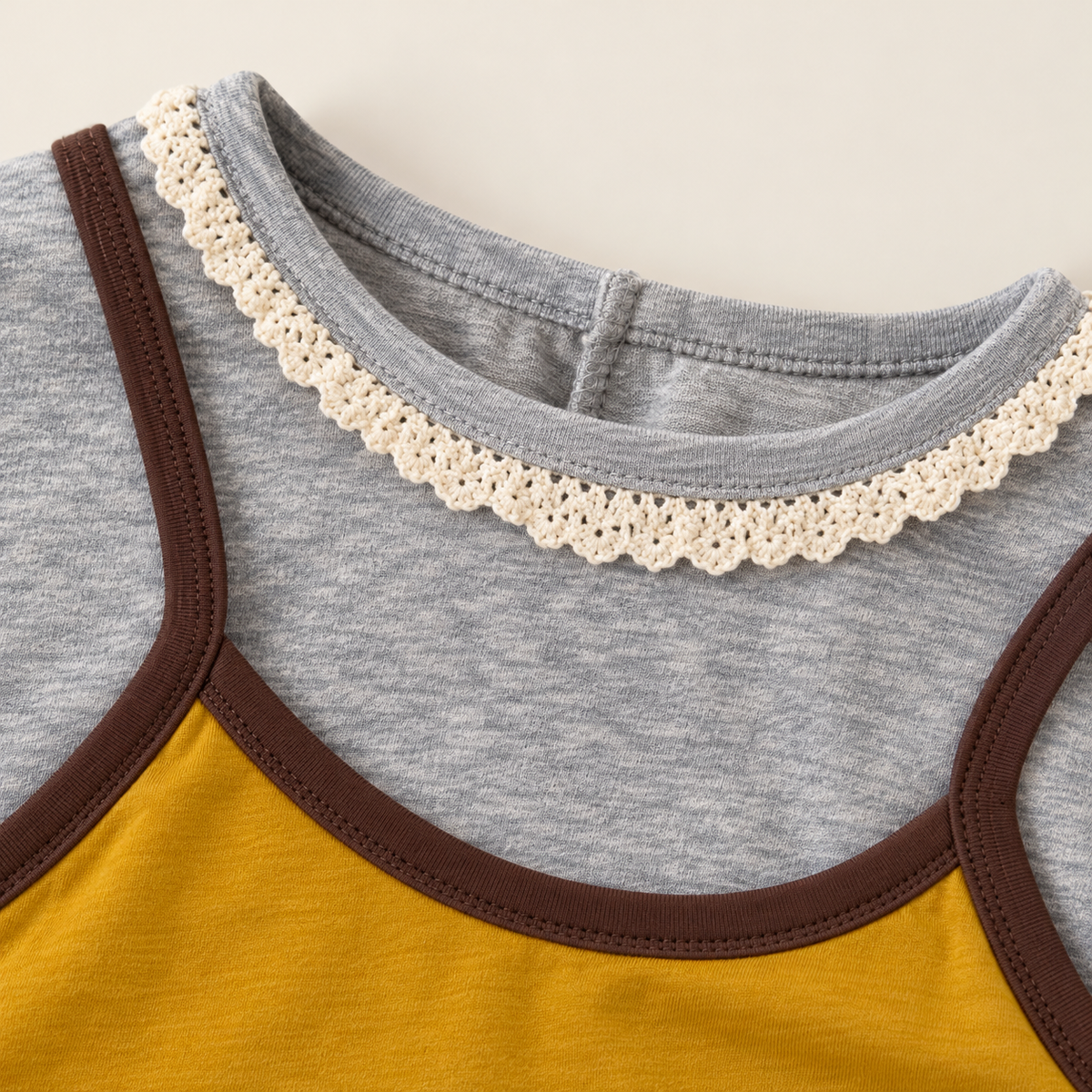 Yellow cat bow top neckline detail.