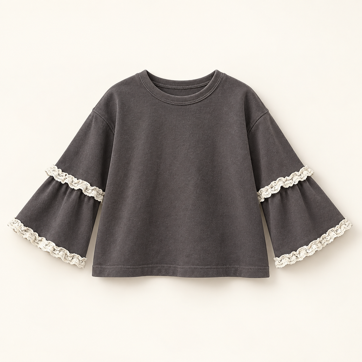 Charcoal-grey children's top with ivory lace-trimmed layered sleeves.