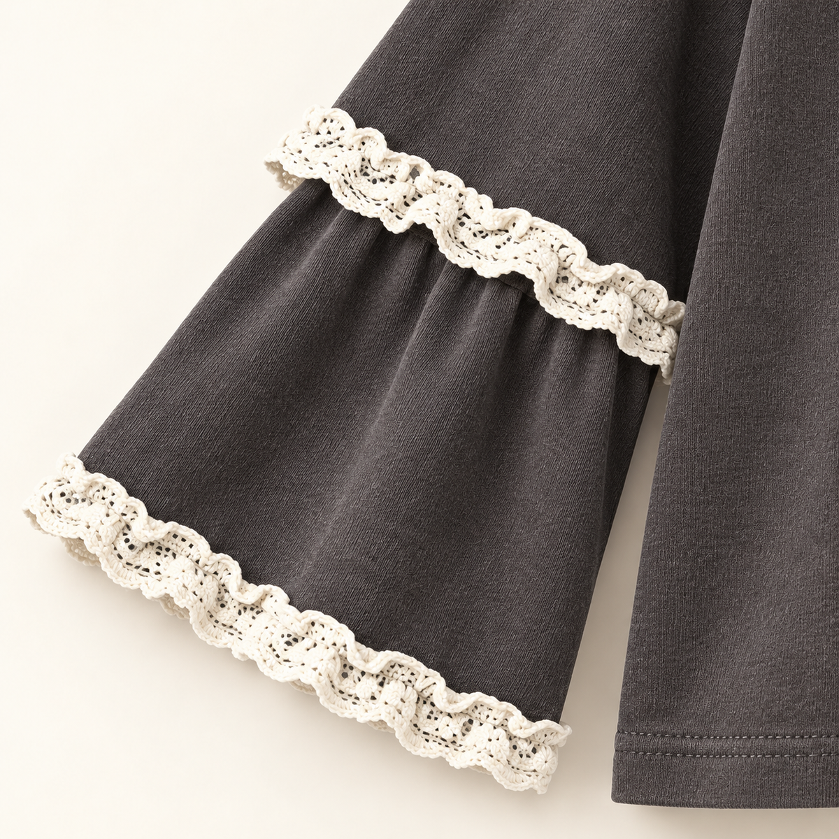 Charcoal Lace-Trim Sleeve Top — layered sleeve with both ivory lace bands, preserve exact scalloped loops and attachment at the upper overlay edge and flared cuff edge