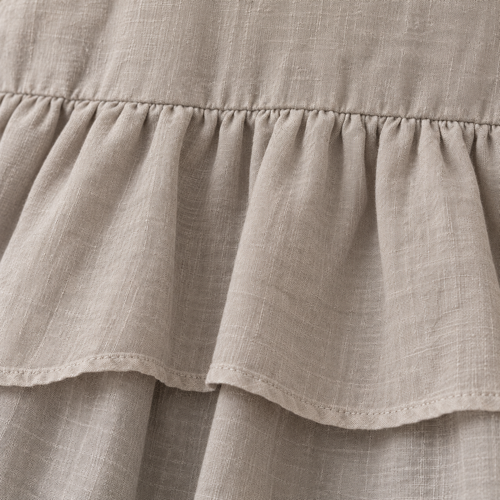 Taupe layered dress and ivory top set, gathered tier texture detail.